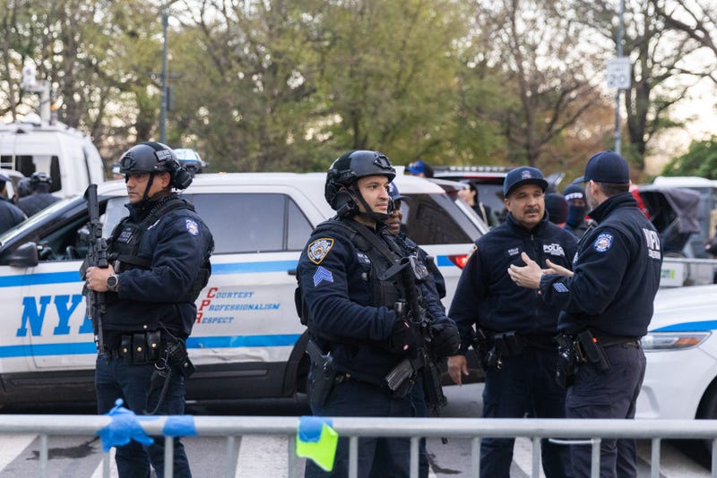 NYPD officers stand guard ahead of the Macy's Thanksgiving Day Parade on November 23, 2022 in New York City. The 96th annual Macy's Thanksgiving Day Parade returns to New York City on Thursday.