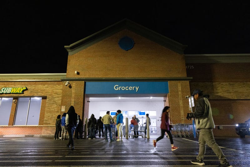 Shoppers lineup outside a Wal-Mart for Black Friday deals on November 25, 2022 in Dunwoody, Georgia. Walmart opened at 6am on Black Friday for shoppers. (Photo by Jessica McGowan/Getty Images)