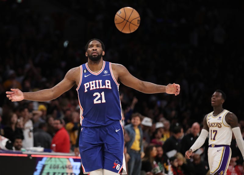 76ers center Joel Embiid, left, celebrates beating the Lakers 113-112 as Lakers point guard Dennis Schroder walks away at Crypto.Com Arena in Los Angeles Sunday, Jan. 15, 2023