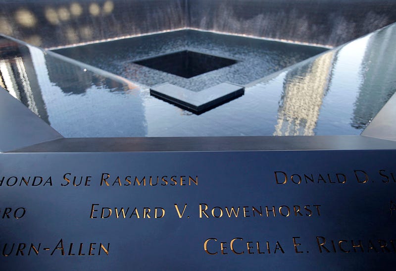 Names of the dead are seen along a 9/11 Memorial pool during the tenth anniversary ceremonies of the September 11, 2001 terrorist attacks at the World Trade Center site, September 11, 2011 in New York City. 