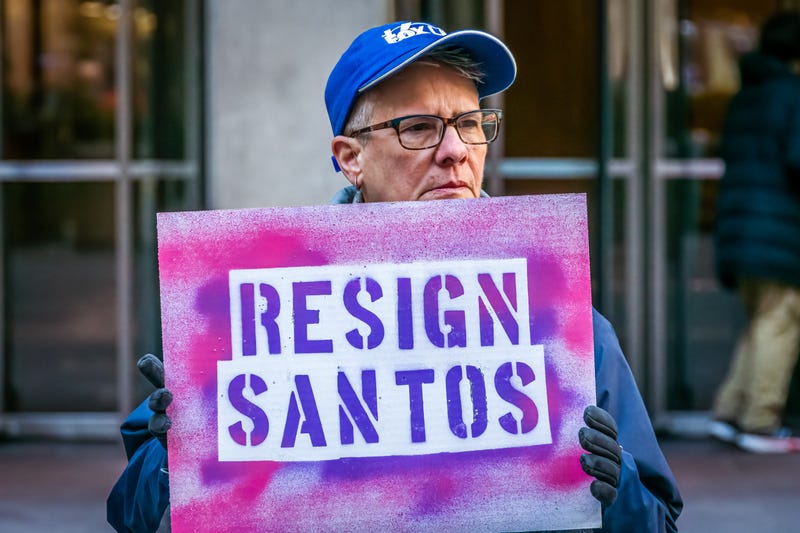 Participant seen holding a sign at the protest.