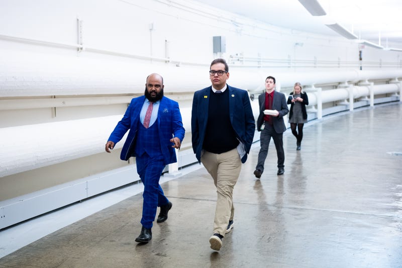 Rep. George Santos, R-N.Y., center, walks through the Cannon tunnel from the U.S. Capitol on Feb. 8, 2023