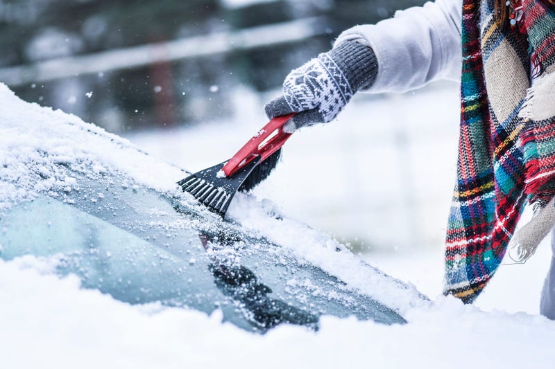 Scraping snow off of car window
