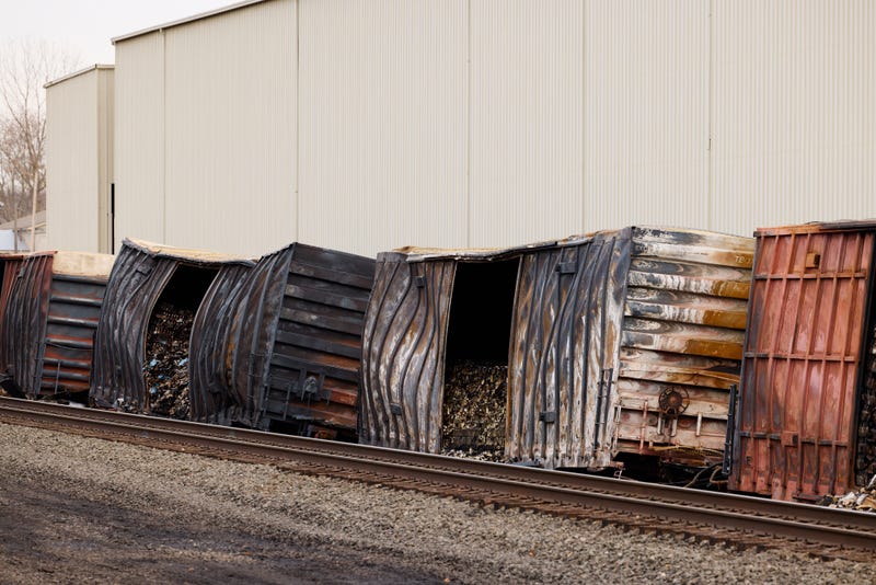Charred train cars sit near railroad tracks on February 14, 2023 in East Palestine, Ohio. The Norfolk Southern train derailed on February 3, releasing toxic fumes and forcing evacuation of residents.