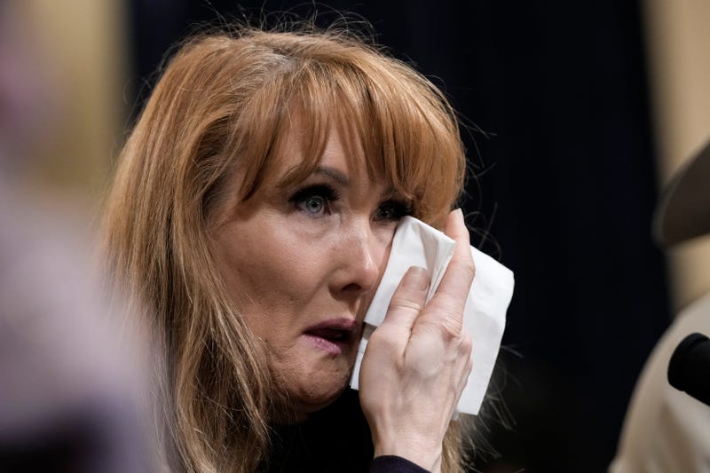 Rebecca Kiessling wiping tears away