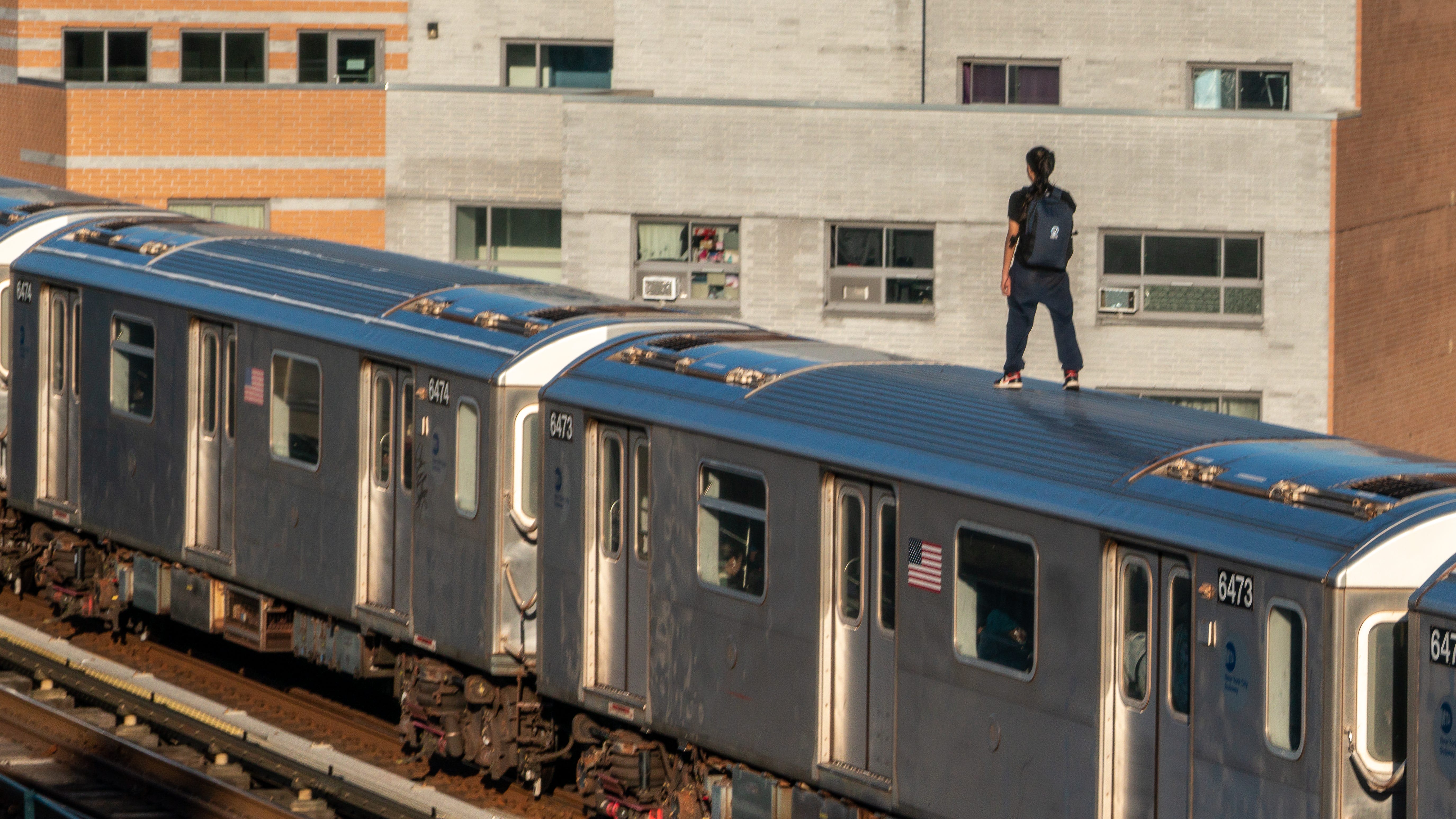 PHOTOS: Person stands on Bronx train, weeks after subway surfer's death