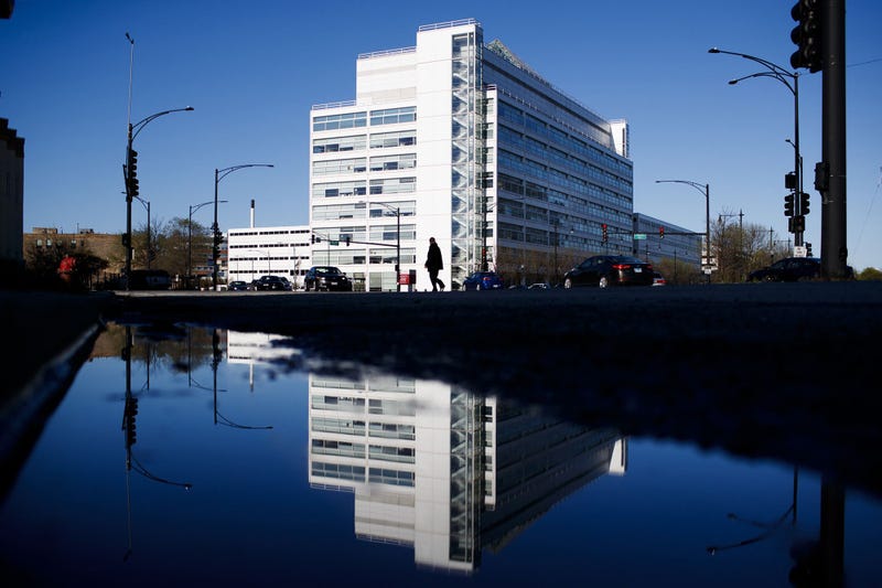 A pedestrian crosses the street outside the Cook County Juvenile Detention Center on April 30, 2020, in Chicago.