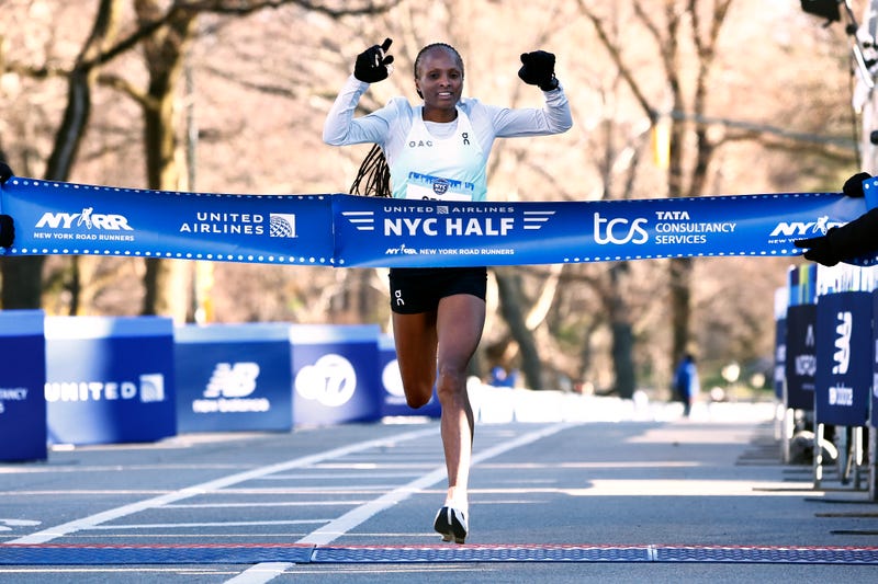 Hellen Obiri of Kenya crosses the finish line to win the Women's United Airlines NYC Half Marathon on March 19, 2023 in New York City.