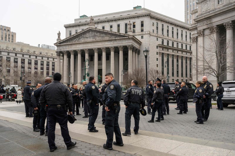 Police gather near the Manhattan Criminal Court and Manhattan District Attorney's Office in Lower Manhattan on March 22, 2023