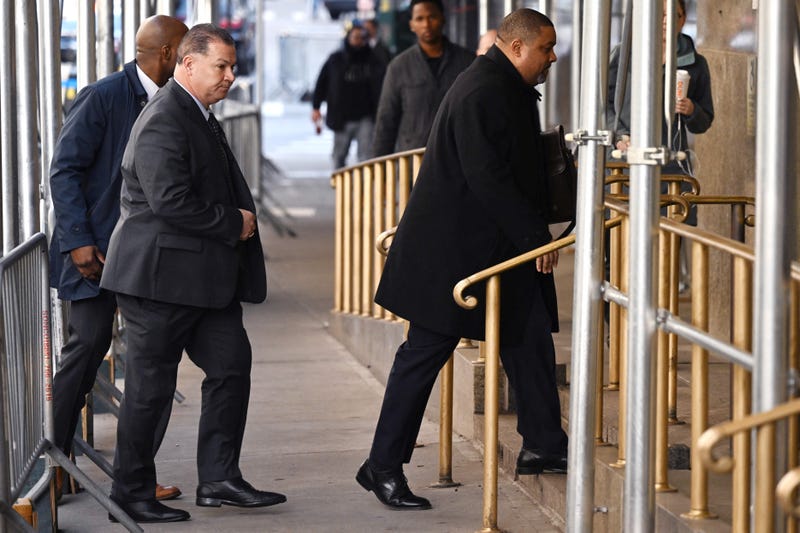 Manhattan District Attorney Alvin Bragg (R) arrives at the Manhattan District Attorney's office in New York City, on March 23, 2023