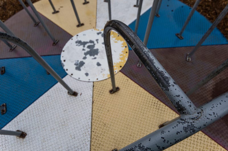 close point of view on an old / retro carousel on a playground