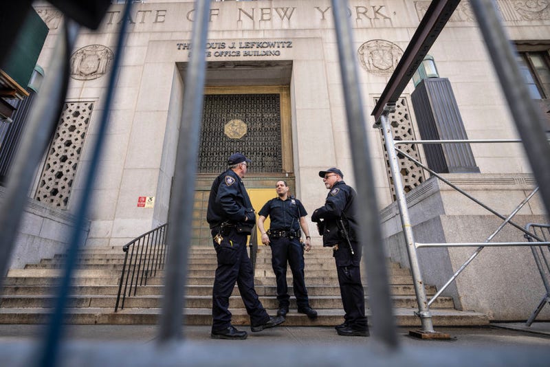 Court security personnel stand outside the Louis J. Lefkowitz State Office Building on March 27, 2023 in New York City. 
