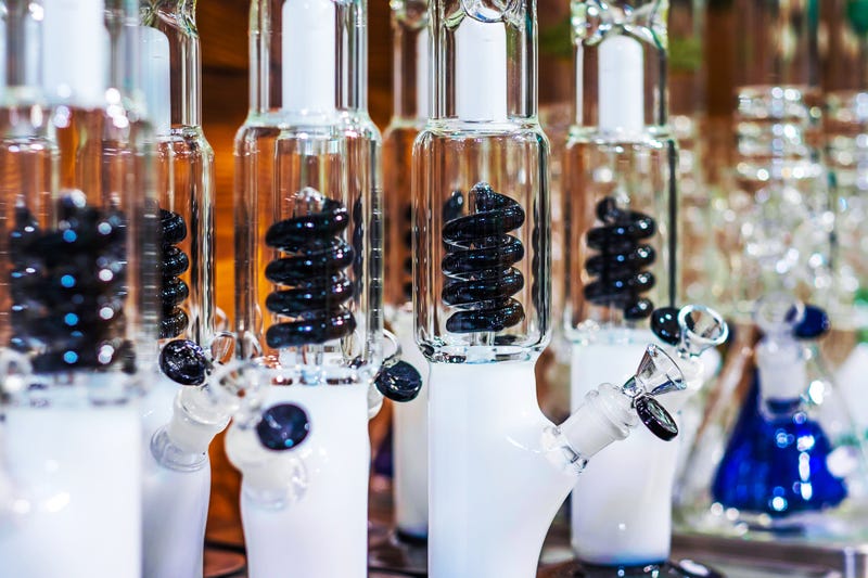 Water pipes, used to smoke cannabis, tobacco and other substances, lined up for sale at a shop.