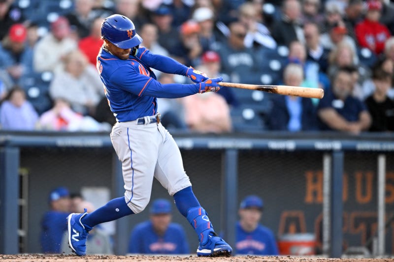 Francisco Lindor #12 of the New York Mets bats during the third inning of a spring training game against the Washington Nationals at The Ballpark of the Palm Beaches on March 20, 2023 in West Palm Beach, Florida. 