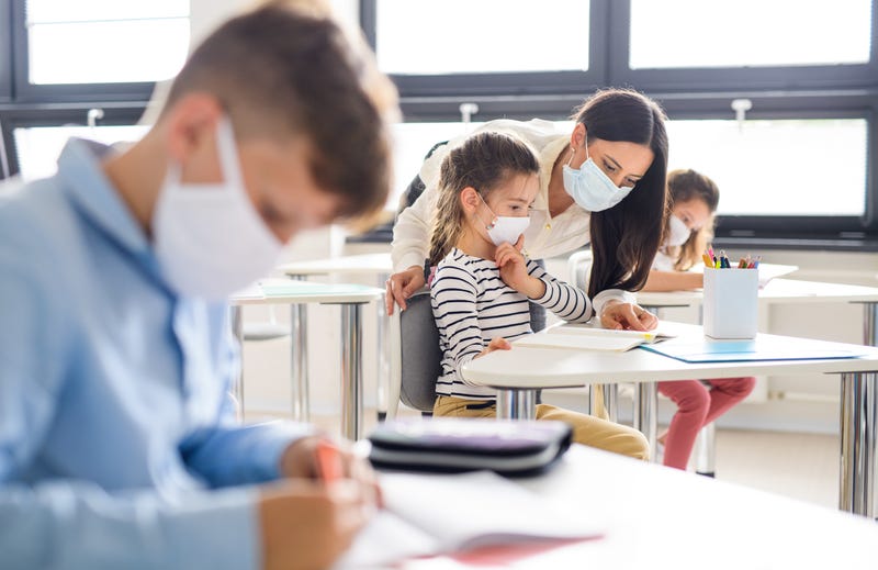 Group of children with face mask back at school after covid-19 quarantine and lockdown