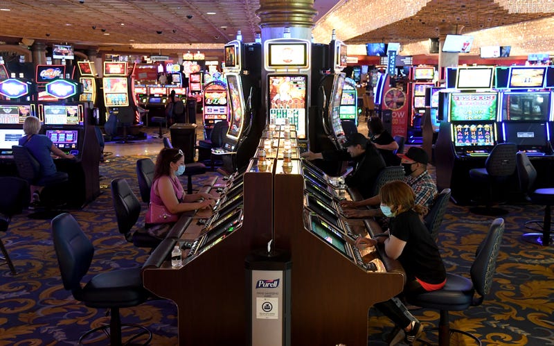 Guests play slot machines at the Westgate Las Vegas Resort & Casino after the property opened for the first time since being closed in mid-March because of the coronavirus (COVID-19) pandemic on June 18, 2020 in Las Vegas