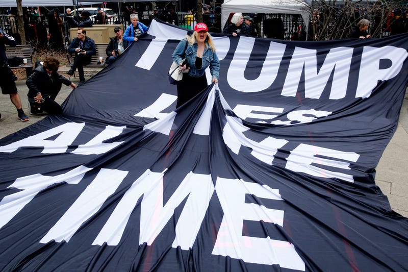 A supporter of Donald Trump argues with opponents outside Manhattan Criminal Court on April 4, 2023