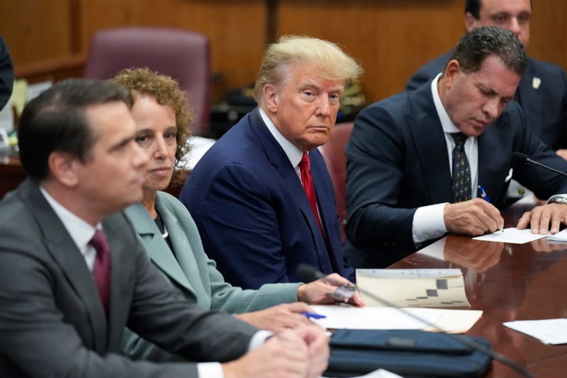 Former U.S. President Donald Trump sits at the defense table with his defense team in a Manhattan court on April 4, 2023 in New York City.