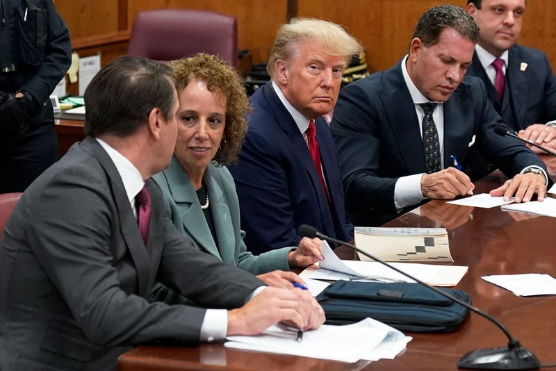 Former U.S. President Donald Trump sits at the defense table with his defense team in a Manhattan court on April 4, 2023, in New York City.