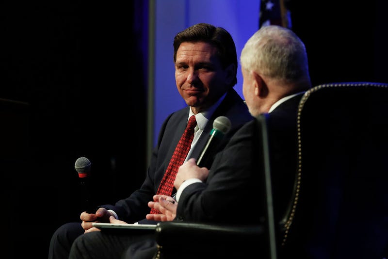 Florida Gov. Ron DeSantis (R-FL) listens to a question from Hillsdale College President Dr. Larry Arnn at Hillsdale College on April 6, 2023 in Hillsdale, Michigan. 
