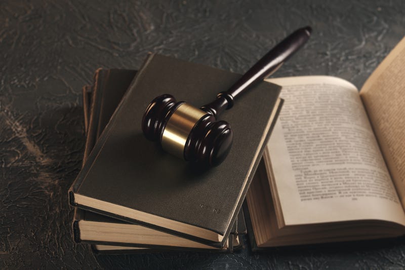Stock image of gavel on law books