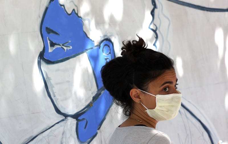An Emergency room doctor paints a mural outside of Zuni restaurant to honor medical workers during coronavirus COVID-19 pandemic on June 22, 2020 in San Francisco, California.