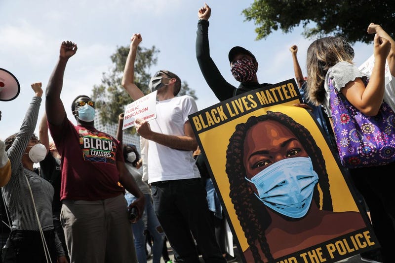 Black Lives Matter-Los Angeles supporters protest outside the Unified School District headquarters calling on the board of education to defund school police on June 23, 2020 in Los Angeles, California. The demonstrators want the funds currently spent on campus police to be reallocated to other student-serving priorities. (Photo by Mario Tama/Getty Images)