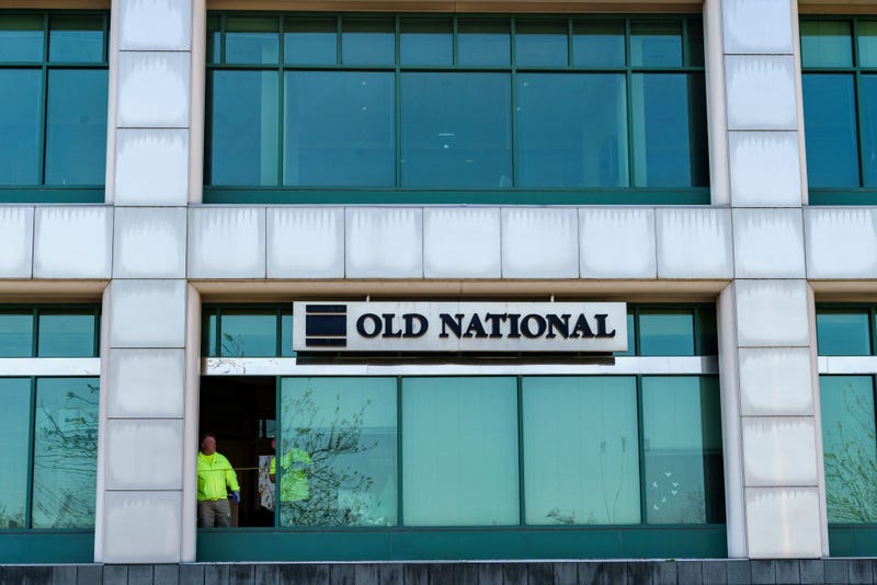 Workers replace a window with bullet holes after a mass shooting at the Old National Bank on April 11, 2023 at Metro Hall in Louisville, Kentucky. On the morning of April 10, a gunman opened fire inside the bank killing four people. A fifth victim later died in the hospital.