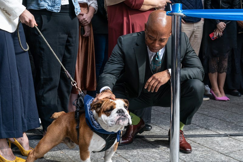 Mayor Eric Adams showing his love for dogs while attending Grand Opening of TransPerfect Headquarters on Broadway