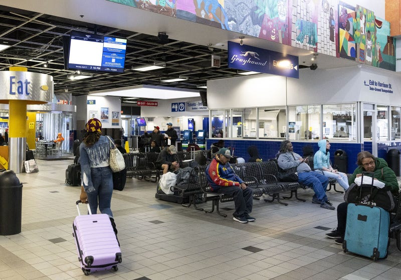 Travelers wait in the Greyhound bus station in the Near West Side neighborhood on April 17, 2023. The station is at risk of closing by October.