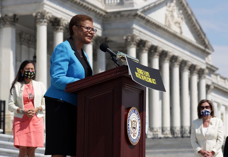 U.S. Rep. Karen Bass (D-CA), Chair of the Congressional Black Caucus, speaks as Speaker of the House Rep. Nancy Pelosi (D-CA) listens during an event on police reform June 25, 2020 at the east front of the U.S. Capitol in Washington, DC.