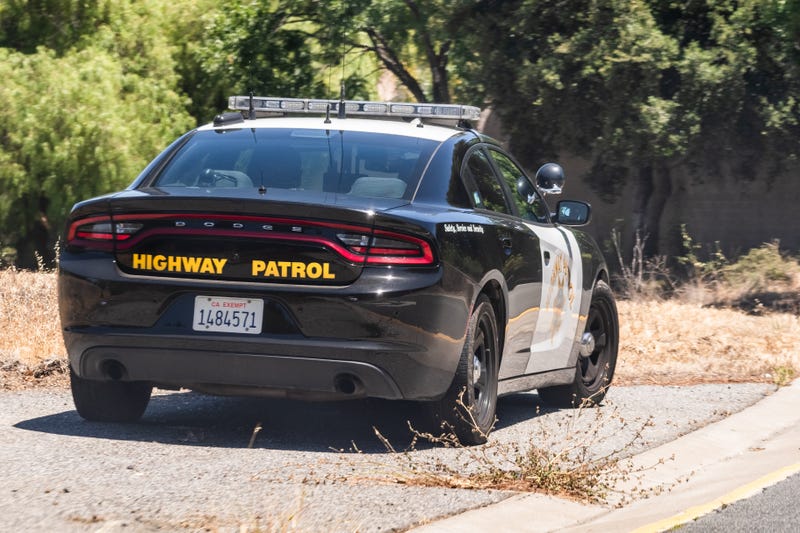 california highway patrol car on shoulder of road