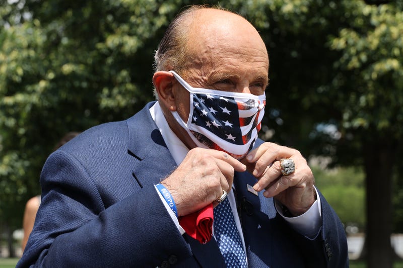 President Donald Trump's lawyer and former New York City Mayor Rudy Giuliani puts on a face mask before talking to journalists outside the White House West Wing July 01, 2020 in Washington, DC. Giuliani did an on-camera interview with One America News Network's Chanel Rion before talking to other journalists about Vice President Joe Biden and the news that Russian intelligence may have paid Taliban operatives to kill U.S. troops in Afghanistan.