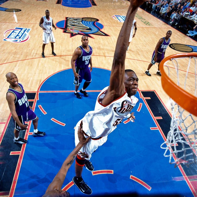 Dikembe Mutombo, #55 of the Philadelphia 76ers, dunks against the Milwaukee Bucks in Game 1 of the 2001 Eastern Conference Finals on May 22, 2001, at the First Union Center in Philadelphia, Pennsylvania.