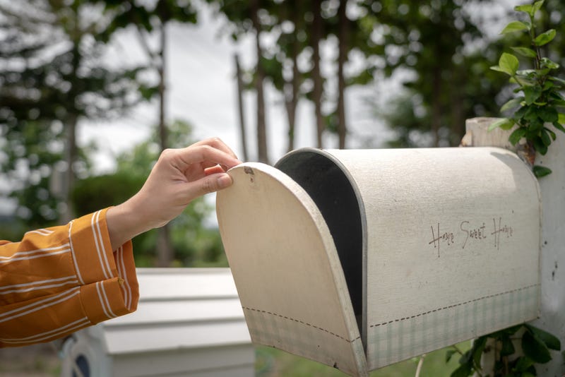 Looking in mailbox stock photo. 