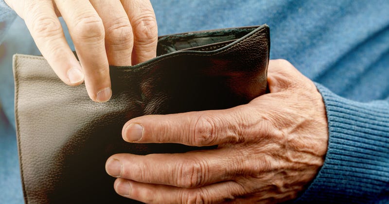 older man with wallet
