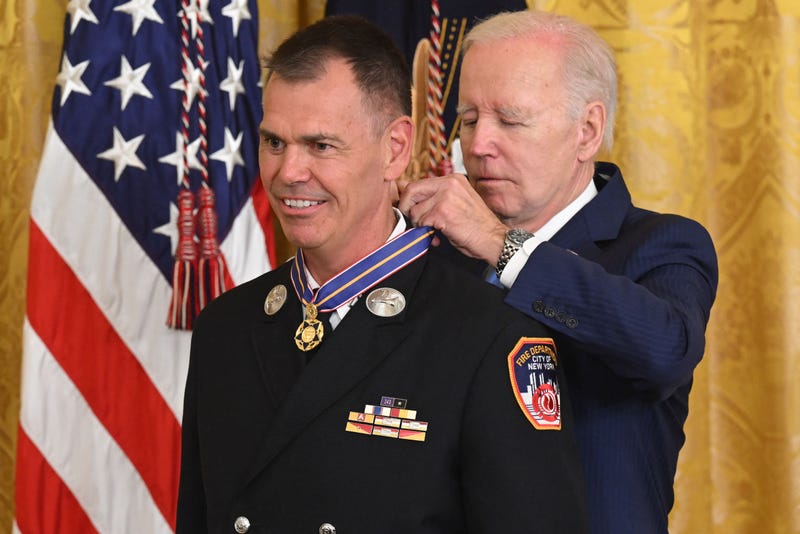 President Joe Biden awards the Medal of Valor to Lieutenant Jason Hickey, of the Fire Department of New York City, in the East Room of the White House in Washington, DC, on May 17, 2023
