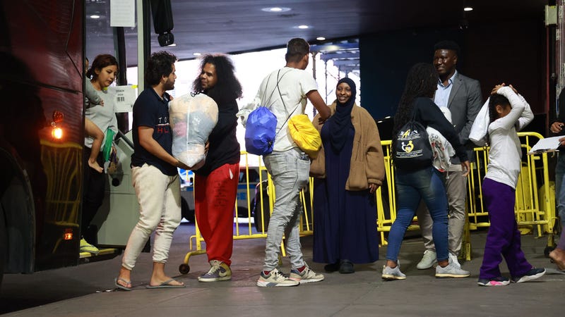 Migrants arriving from Texas are greeted by volunteers at the Port Authority Bus Terminal on May 17, 2023
