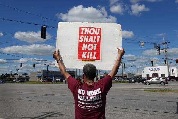 Sylvester Edwards expresses his opposition to the death penalty during a protest on July 13, 2020 in Terre Haute, Indiana.