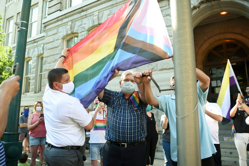 From left: Enrique Castro, vice president of the Reading Pride Celebration; Ben Renkus and Mayor Eddie Moran work together to raise the Progress Pride flag in celebration of LGBTQ Pride Month in front of Reading City Hall on Friday, June 12, 2020.