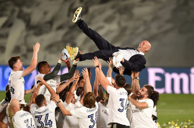 Real Madrid head coach Zinedine Zidane is thrown up in the air by his players after Madrid secure the La Liga title during the Liga match between Real Madrid CF and Villarreal CF at Estadio Alfredo Di Stefano on July 16, 2020 in Madrid, Spain