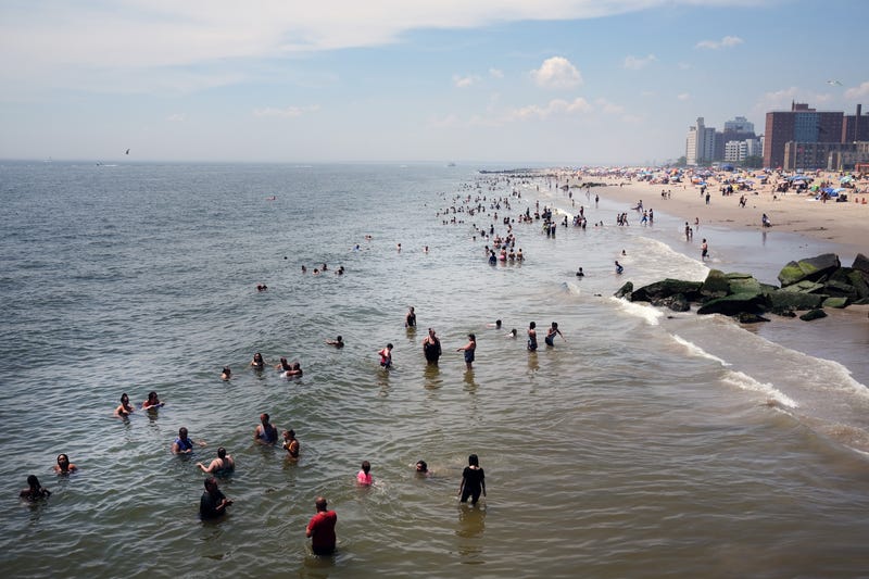 People visit the beach at Coney Island in Brooklyn