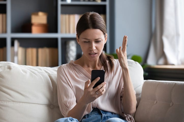 woman looking at phone