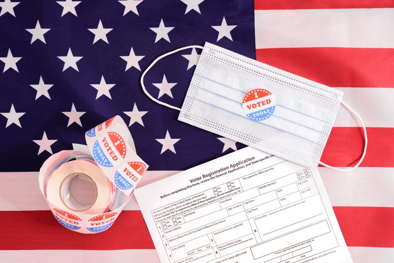 I Voted stickers, mask, voter registration application