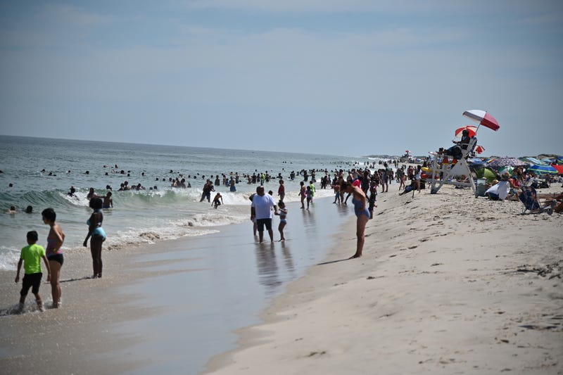 File photo: Beachgoers enjoy the weather at Island Beach State Park in Berkeley Township, NJ