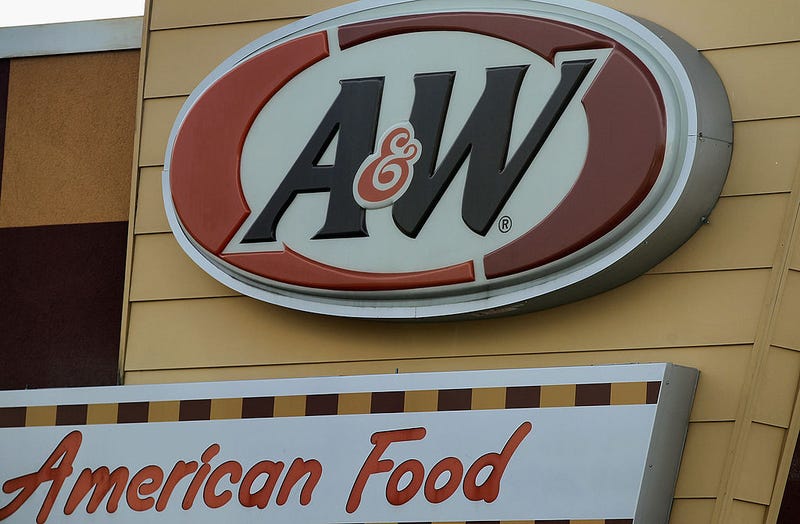 A sign hangs above a Yum Brands A&W restaurant