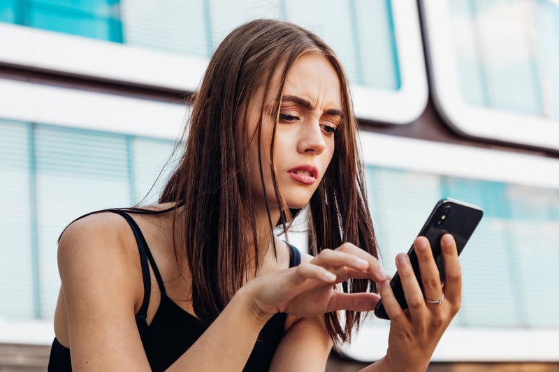 teen looking at phone