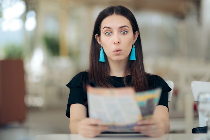 Woman reading her horoscope