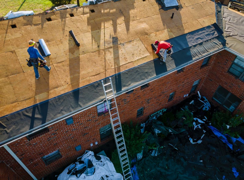 Remove old shingle roof construction worker on a renovation roof the house installed new shingles