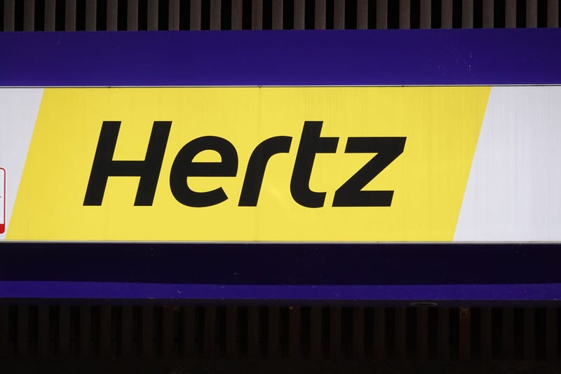 A sign hangs above a Hertz rental car office on August 04, 2020 in Chicago, Illinois. 